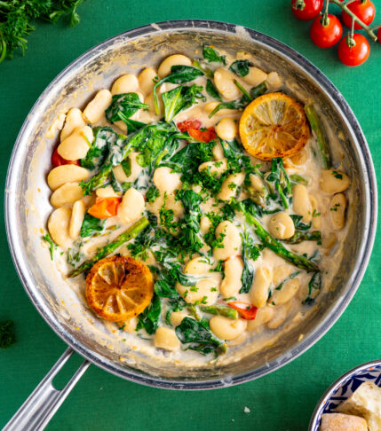 a pan of spring butter beans and vegetables